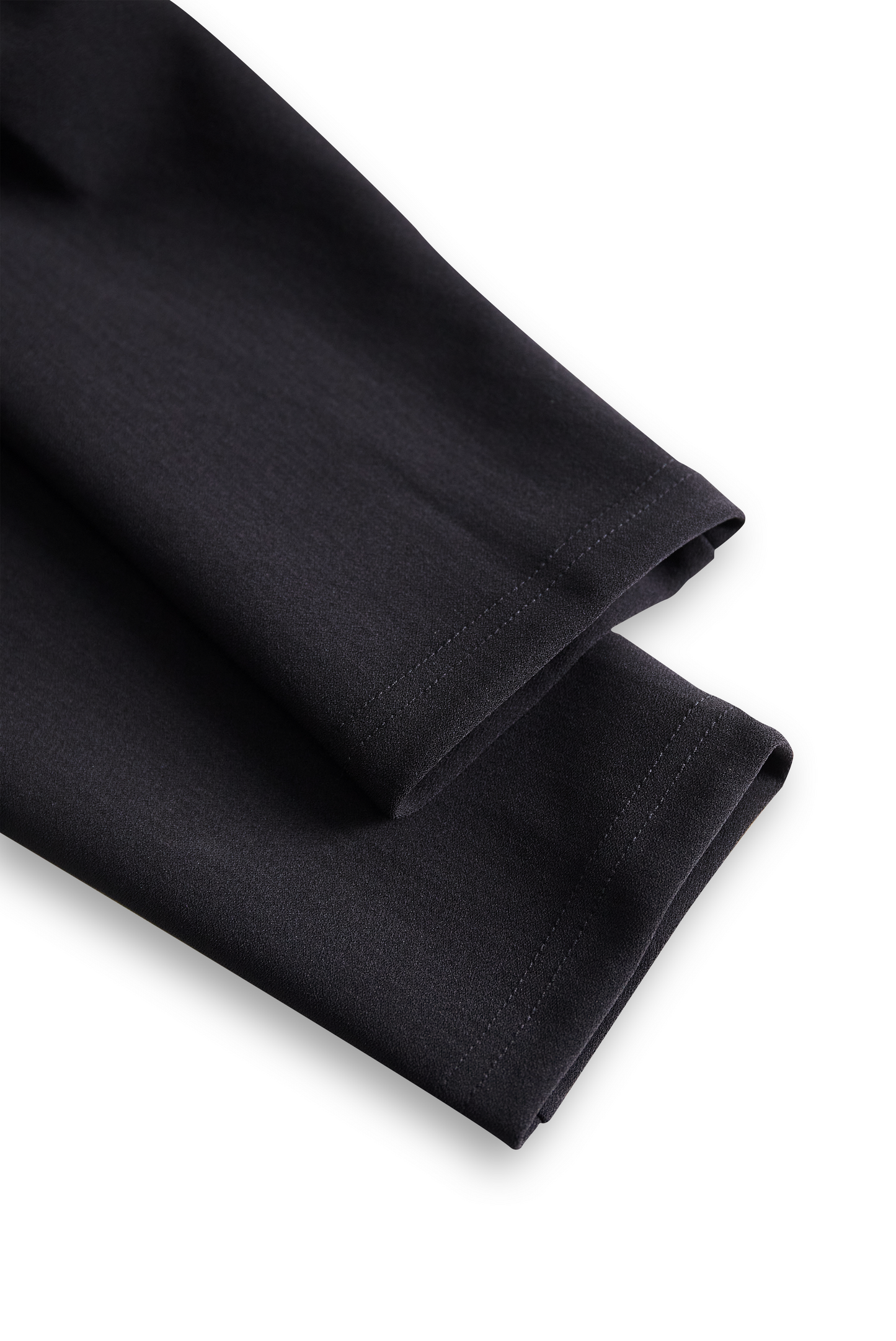 Klasični kombinezon s pasom v slonokoščeni barvi 