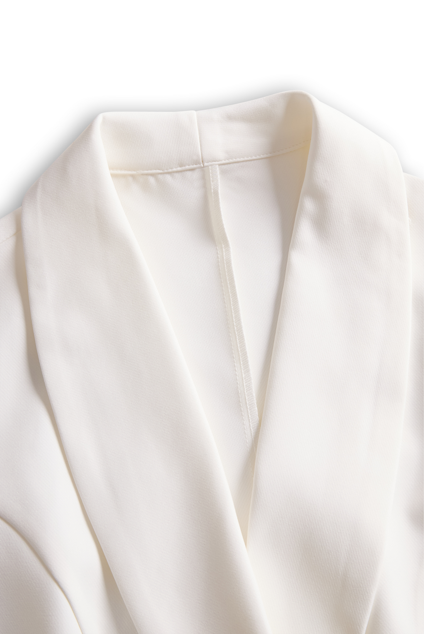 Klasični kombinezon s pasom v slonokoščeni barvi 