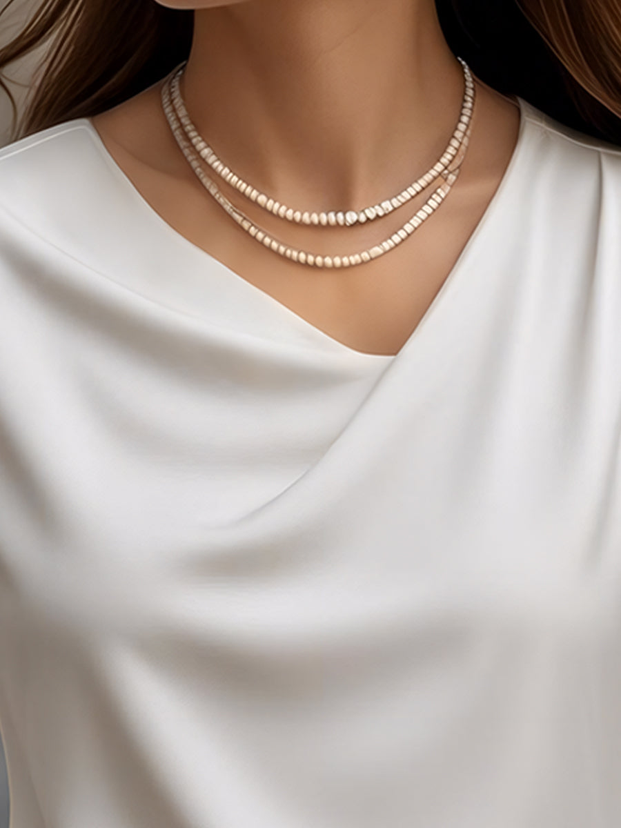 Elegantna enobarvna bluza s kratkimi rokavi in ​​ovratnikom 