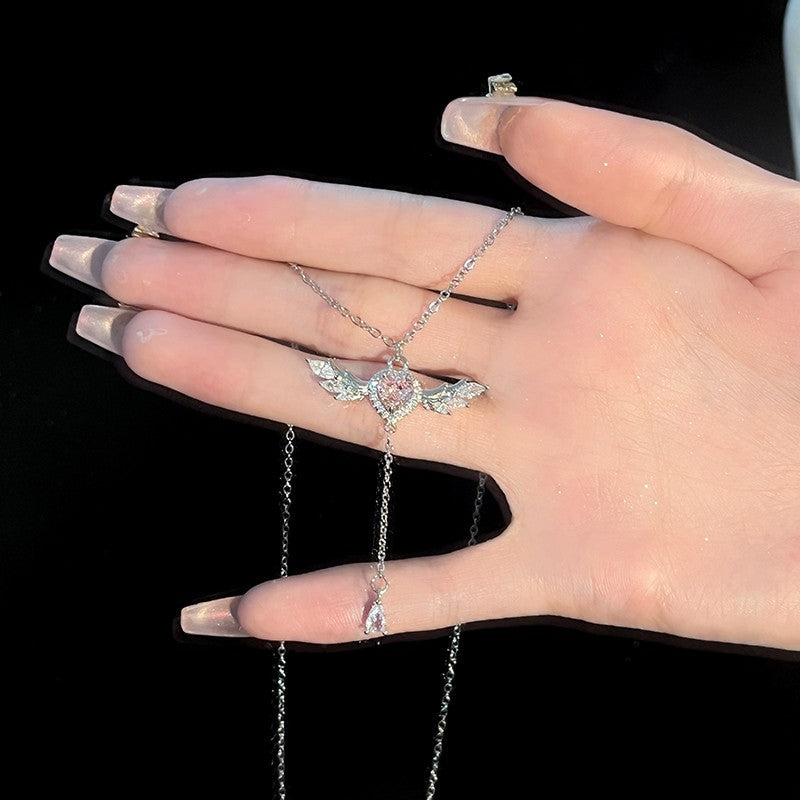 Ogrlica z roza diamanti in angelskim srcem