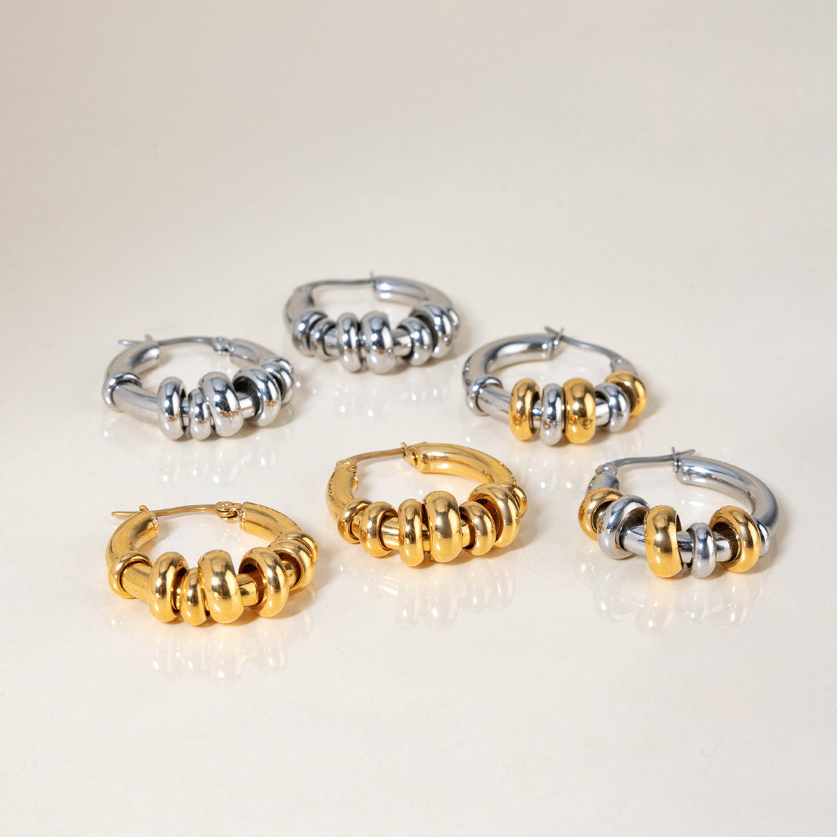 Geometrični prepleteni prstani uhani