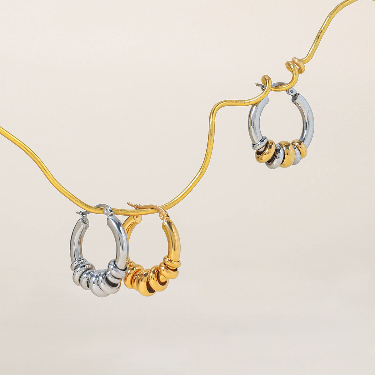 Geometrični prepleteni prstani uhani