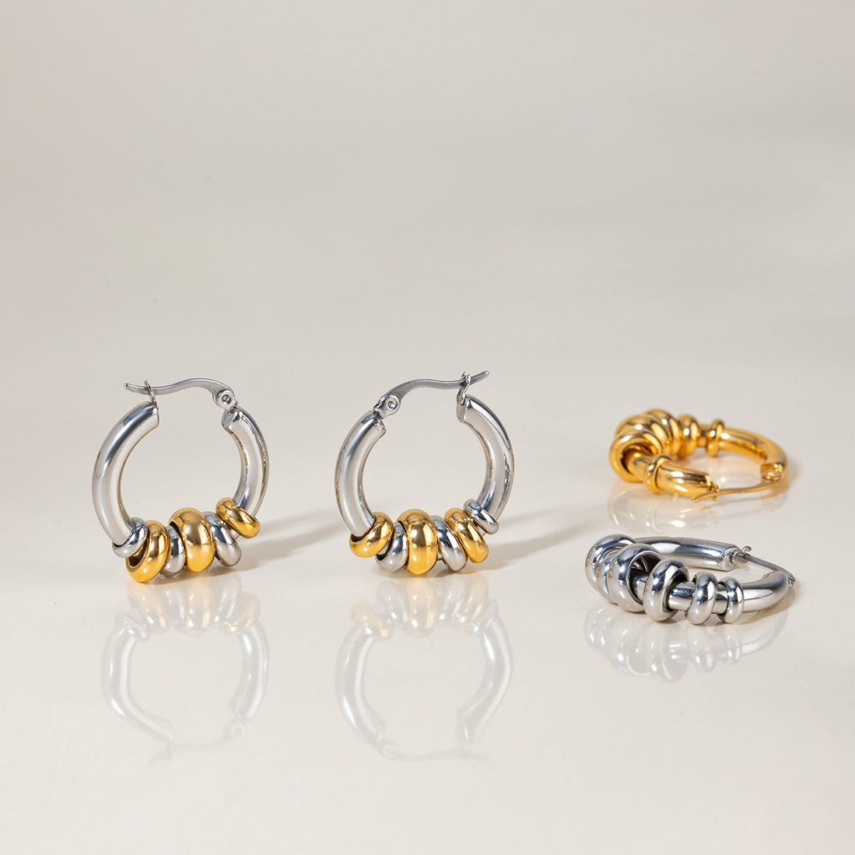 Geometrični prepleteni prstani uhani