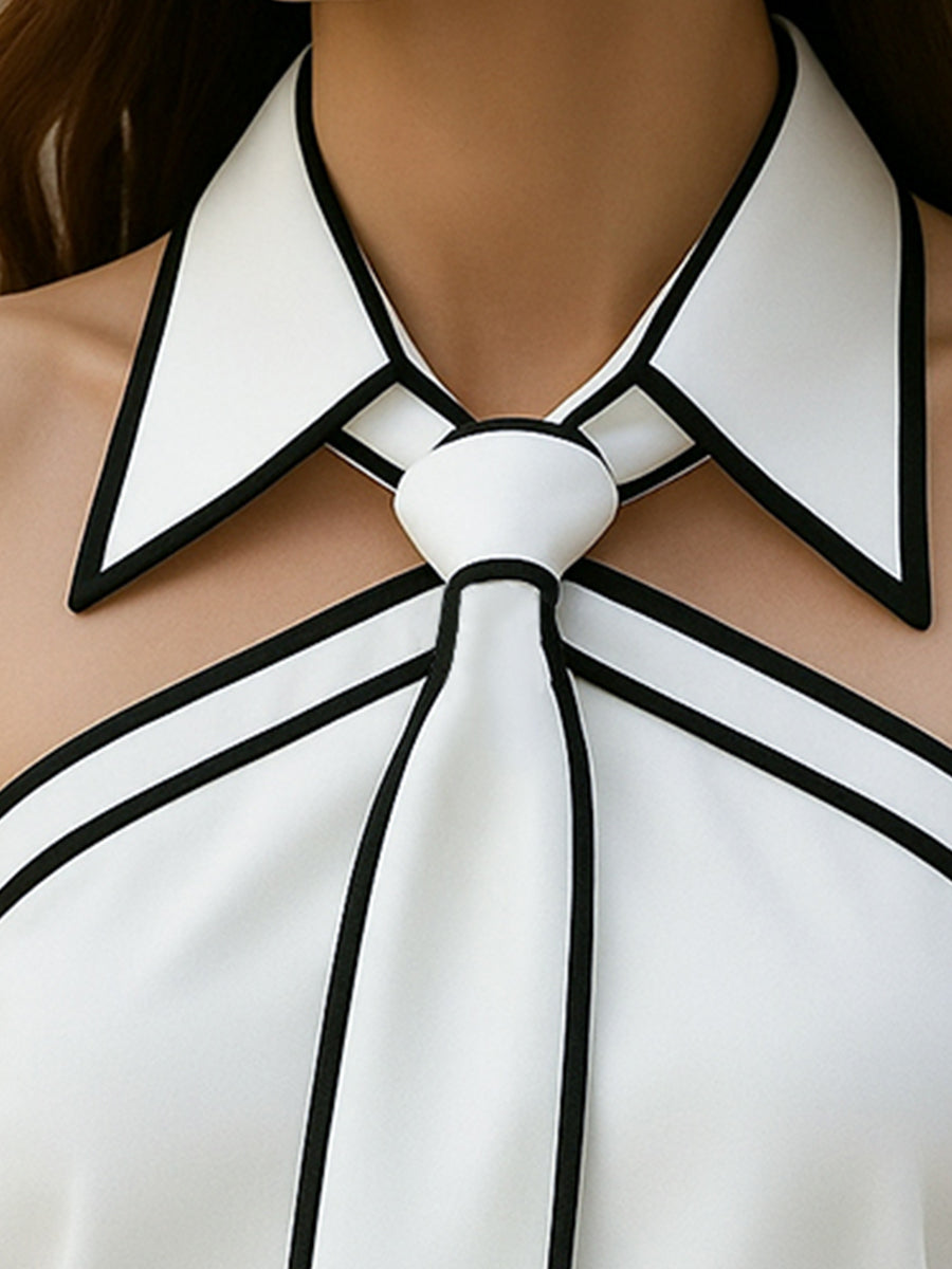 Elegantna bluza brez rokavov z ovratnikom in drzno kontrastno obrobo 