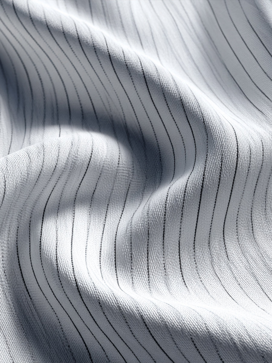 Obleka z V-izrezom in asimetričnim robom 